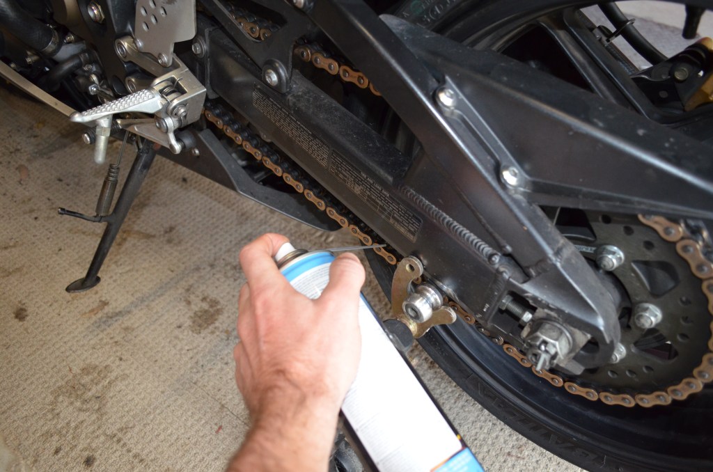 Here's the most important part. Spray the inside of the train LIGHTLY and spin the rear wheel at the same time. Complete a couple of rotations to make sure you get the whole of the chain. When you are sure you have lubricated the chain sufficiently, spin the wheel several times. By spraying the inside of the chain, the chain lube doesn't go everywhere and lubricates your chain properly. 