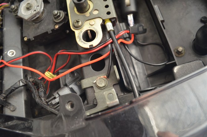 Connect your negative cable to a grounding source. You can see here I have connected mine to a bolt on the sub frame. 