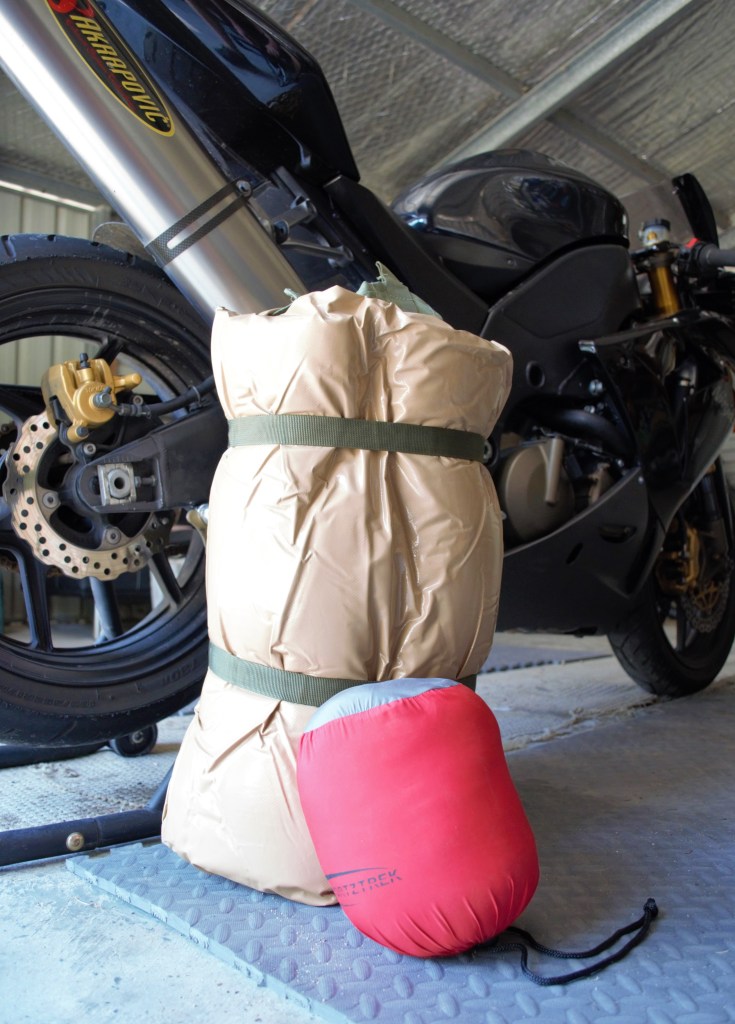 Biker swag and expandable pillow. The biker swag is very nearly half the size of a king single. 